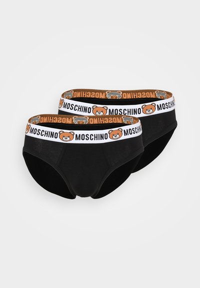 Fekete pamut alsónadrág narancssárga és fehér Moschino logós derékrésszel, amelyen medve grafika látható. Simaságával és klasszikus kialakításával tűnik ki.