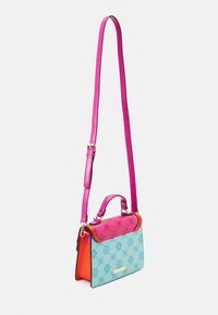 Colorful handbag featuring a blue body with floral patterns, pink top flap, orange accents, and adjustable pink strap. Textured leather finish.