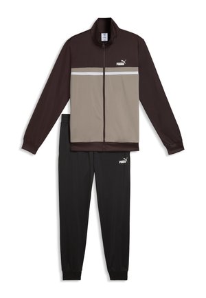 Heren Puma trainingspak met een bruin-beige ritsjack en zwarte broek met elastische tailleband, beide met het Puma-logo.