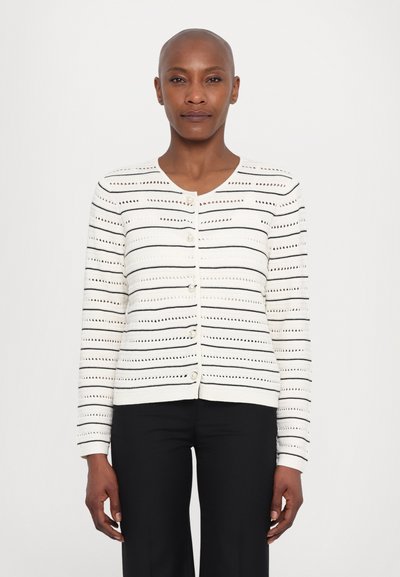 White cardigan with black horizontal stripes. Features a round neckline, buttons down the front, and a textured knit pattern. Long sleeves.