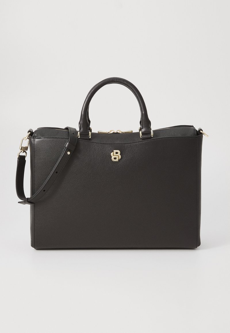 Sort læder handbag med en tekstureret finish, hardware i guldtoner, dobbelt top-håndtag og en justerbar skulderrem. Har et logo-akkent.