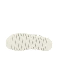 White rubber shoe sole with textured traction pattern, featuring deep grooves and a rounded toe design. Clean, minimal style.