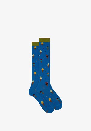 Blue knee-high socks with a green cuff, featuring colorful ice cream cone patterns and small colorful dots throughout the fabric.