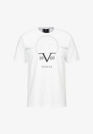 Weißes Baumwoll-T-Shirt mit kurzen Ärmeln, das ein kreisförmiges Löwengrafik und den Text "1969 ITALIA" in Grau zeigt. Horizontale graue Streifen auf den Schultern.
