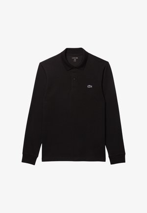 Polo shirt noir à manches longues en coton, avec un col à boutons, des poignets côtelés et un petit logo Lacoste blanc sur la poitrine gauche.
