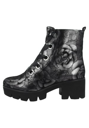 Schwarzer Schnürstiefelette mit klobigem Absatz und Sohle, mit grauem Blumenmuster auf dem Lederobermaterial.