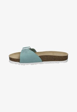 Ljusblå sandal med ett enda band, korkfotbädd och texturerad vit gummisula. Har en kvadratisk detalj med silverfärgad spänne.