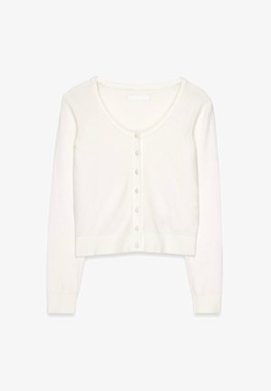 Balta trumpa kardiganas, užsegamas prieky su apvaliu kaklu. Megzta tekstūra, banguoti rankogaliai ir apatinė dalis, bei mažos atitinkančios knygelės.