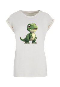 White short-sleeve t-shirt featuring a cartoon green dinosaur graphic at the center. Soft fabric with a relaxed fit and rolled sleeves.