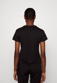 Pinko T-shirt Quentin con logo gioiello bianco