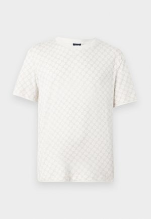 Chemise blanche à manches courtes avec un col rond et un motif circulaire délicatement en relief sur le tissu.
