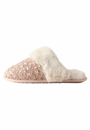 Chausson rose doux à enfiler avec dessus en tissu à sequins et doublure ainsi que bordure en fausse fourrure blanche.