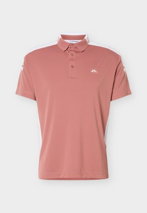 Korte mouwen dusty roze poloshirt met een knoopsluiting bij de kraag, witte zijpanelen, en een klein wit logo op de borst en mouwen.