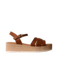 Sandale compensée en cuir marron avec bride à boucle à la cheville et semelle plateforme tissée style espadrille, vue de côté.