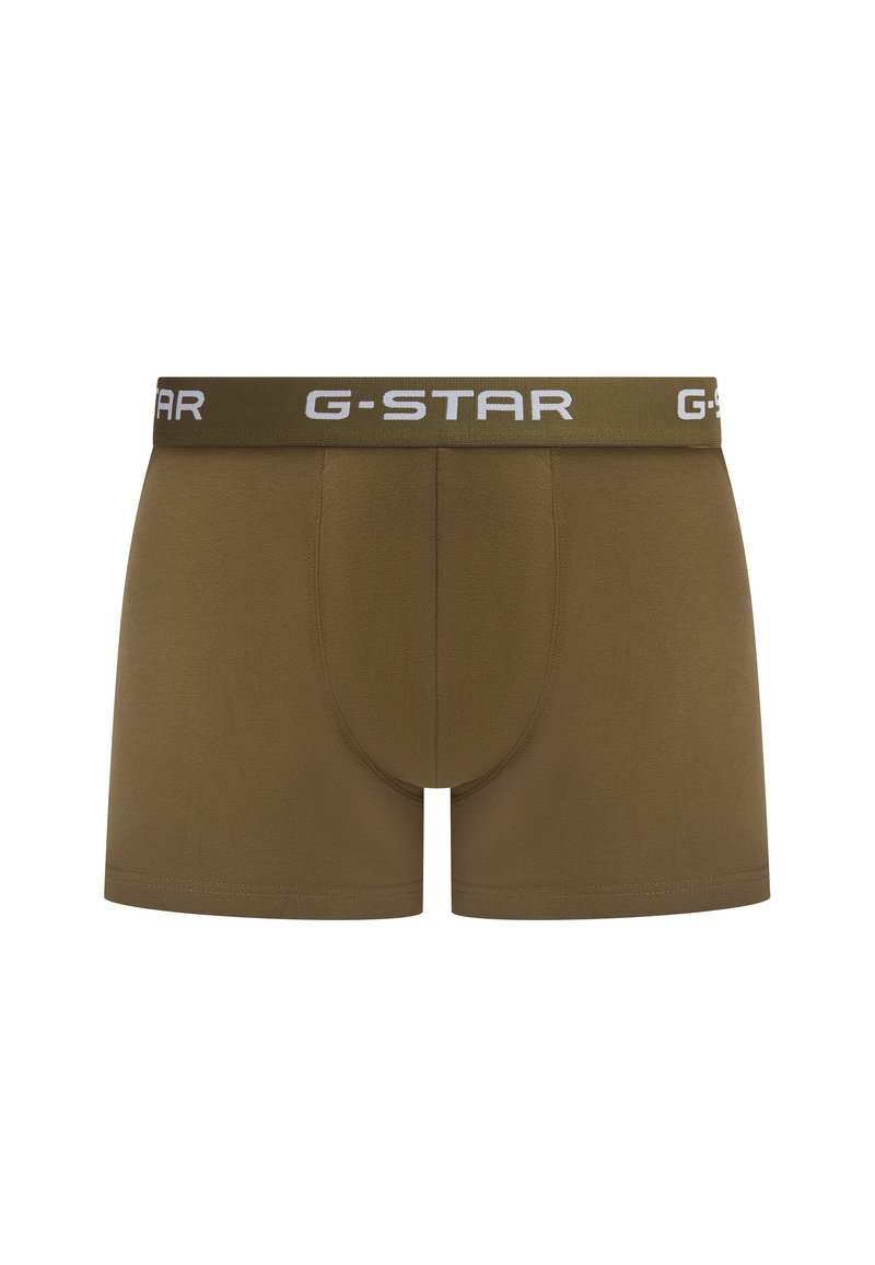 Braune Boxershorts mit glatter Textur, ausgestattet mit einem dicken grünen Bund und dem weißen "G-STAR"-Logo. Das Design umfasst eine konturierte Tasche.