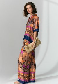Next Nohavice - brown floral print