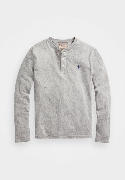 Gray long-sleeve henley shirt made of soft fabric, featuring a three-button placket and a small blue embroidered logo on the chest.