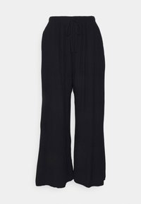 Pantalons larges noirs en tissu léger et texturé, dotés d'une taille élastique et d'un cordon de serrage ajustable.