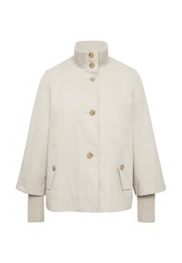 Beige jas met een hoge, geribbelde kraag, drie grote knopen en twee zijzakken. Heeft een ontspannen pasvorm en een soepele stoftextuur.