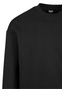 Sweat-shirt noir à col rond, manches longues, col côtelé et étiquette visible "Urban Classics" taille M à l'intérieur de l'encolure.
