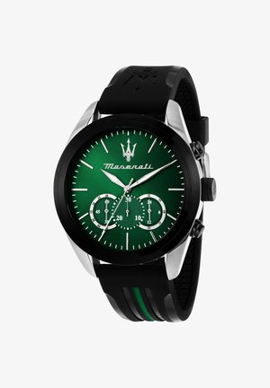 Montre à cadran vert avec accents en acier inoxydable, boîtier noir et bracelet en caoutchouc avec des rayures vertes ; comprend des sous-cadrans pour l'heure.