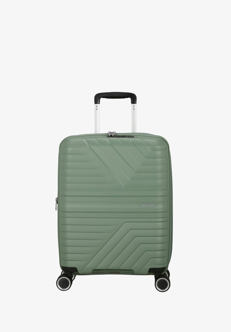 Valigia rigida verde con una texture a motivo lineare, cerniera argentata e manico in alluminio retrattile; dotata di quattro ruote per la mobilità.