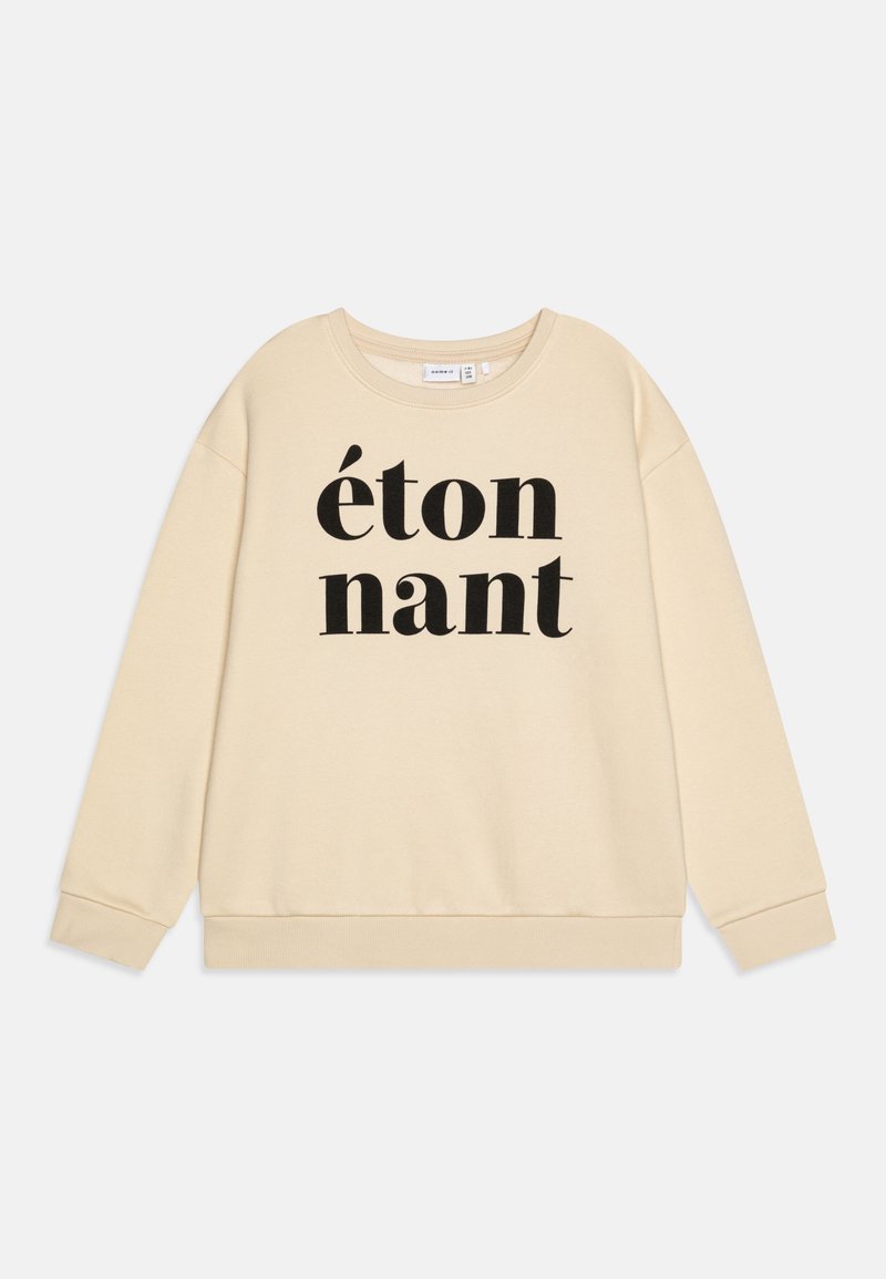 Beige mikina s černým potiskem "étonnant." Má kulatý výstřih a žebrované manžety a lem. Měkká, strukturovaná látka.