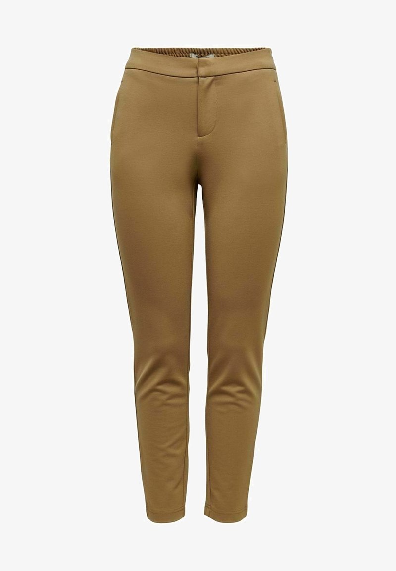 Pantalons de sport beige à coupe ajustée, avec une taille élastique et des poches latérales, présentant une texture lisse et un design minimaliste.