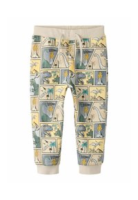 Spodnie dresowe z bawełny z nadrukiem komiksowym o tematyce dinozaurów w pastelowych kolorach, z elastycznym paskiem i ściągaczami przy kostkach.