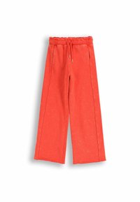 Czerwone spodnie o szerokich nogawkach z ściągaczem w pasie i sznurkiem. Wykonane z miękkiego materiału, z bocznymi kieszeniami i gładką teksturą.