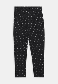 Calças pretas com cintura elástica, adornadas com bolinhas brancas, ajustadas ao corpo e de textura suave. Sem bolsos visíveis.