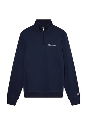 Sudadera azul marino con cuello alto y media cremallera. Cuenta con bolsillos laterales y un logo bordado en blanco en el pecho. Textura de tela suave.