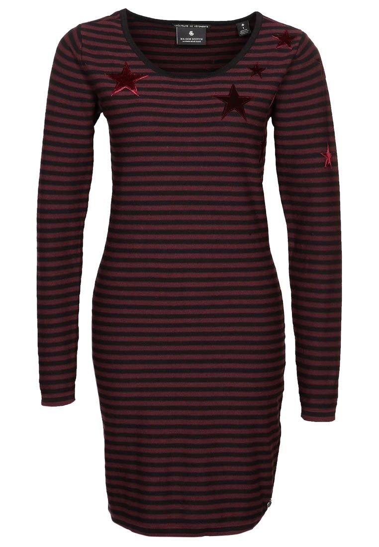 Raidallinen mekko, jossa on pitkät hihat, tumman viininpunaisena ja mustana. Edessä kirjailut punaisilla tähdillä. Pehmeä, joustava kangas. Normaali istuvuus.
