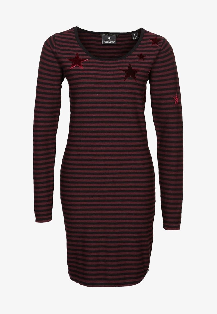 Raidallinen mekko, jossa on pitkät hihat, tumman viininpunaisena ja mustana. Edessä kirjailut punaisilla tähdillä. Pehmeä, joustava kangas. Normaali istuvuus.