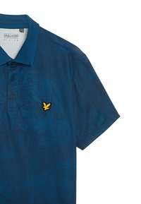 Polo shirt blu con un motivo testurizzato, maniche corte e un logo aquila ricamato giallo sul lato sinistro del petto. Presenta un colletto.
