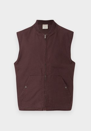 Uten ermer, mørkebrun hettevest med ribbestrikket krage og to frontlommer lukket med trykknapper, vist på hvit bakgrunn.