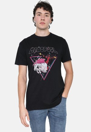 Black cotton t-shirt featuring a graphic print of Deadpool, a unicorn with pink mane, and geometric accents in pink and blue. Classic crew neck design.