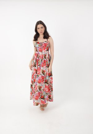 Robe maxi à motif floral multicolore avec des bretelles spaghetti ajustables et un corsage cintré. Fabriquée en tissu léger.
