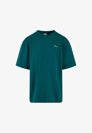 Turkusowa bawełniana koszulka z luźnym krojem, okrągłym dekoltem, krótkimi rękawami i złotym haftowanym logo na lewej piersi. Gładka struktura.