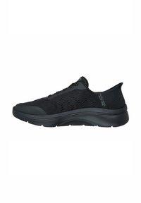 Black athletic shoe featuring a knit upper, smooth texture, low-rise design, and a cushioned sole for comfort. Includes lace-up closure.