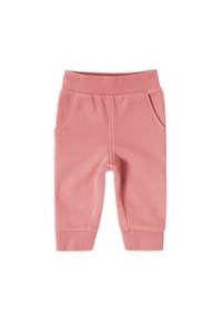 Pantalones de chándal de algodón rosa con una banda elástica en la cintura, dos bolsillos laterales y puños de canalé. Textura suave con un acabado de color sólido.