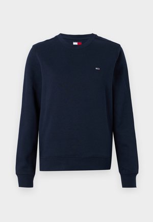 Hanorac bleumarin din bumbac, cu guler rotund și manșete cu nervuri. Detaliu mic cu logo pe piept. Design de tip classic.