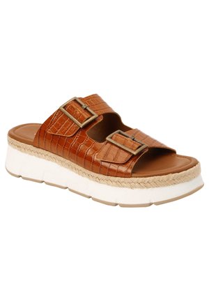 Brune slip-on sandal med to justerbare spænder, tekstureret læderoverdel, vævet jute trim og tykk hvid gummi sål.