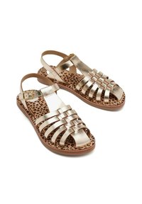 Sandali strappy oro metallizzato con suola piatta, dotati di una soletta con stampa leopardata e una cintura regolabile.