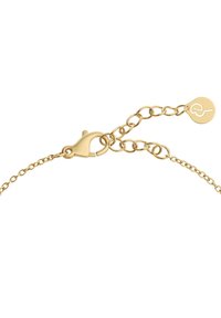 Zlata zapestnica s sponko v obliki jastreba in nastavljivo dolžino, z okroglo oznako, ki vsebuje stilizirano gravuro.