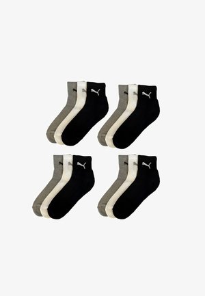 Ein Paket mit vier Paaren von Knöchelsocken in zwei Farben: Schwarz und Grau. Jede Socke hat einen kontrastierenden weißen Streifen und ein Logo.