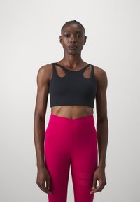Stronger SHAPING CUT OUT BRA - Sujetadores deportivos con sujeción media - black