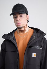 PREY TRUCKER UNISEX - Pet - black