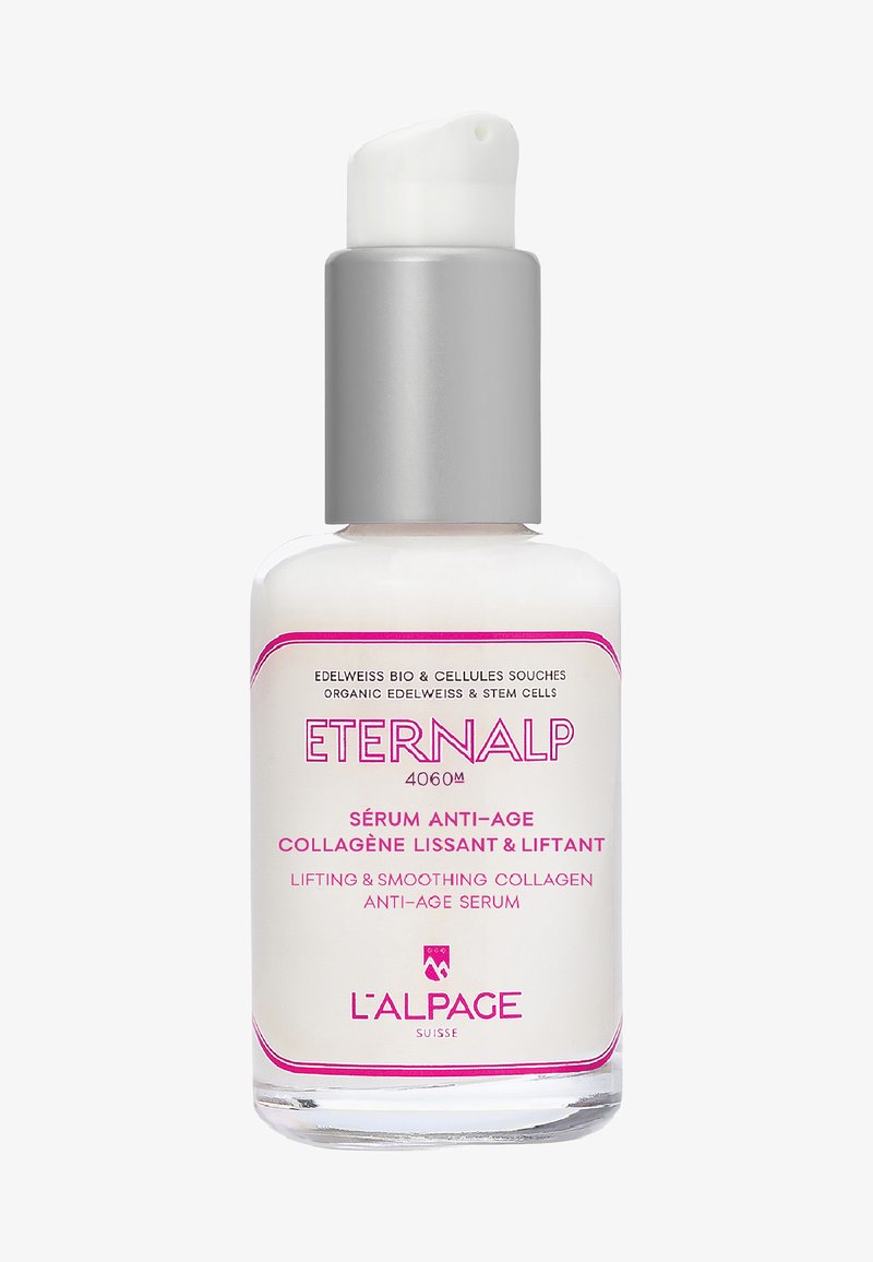 Bouteille blanche avec un capuchon pompe argenté, dotée d'accents roses. Le texte inclut "ETERNALP" et des détails sur le produit en plusieurs langues.