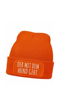 Orange knit beanie with a folded brim features a rectangular patch displaying the text “DER MIT DEM HUND GEHT” in white.